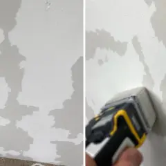 Le mur en toile de verre présente des zones abîmées, comme des taches d'humidité. Un outil est utilisé pour évaluer les dégâts.
